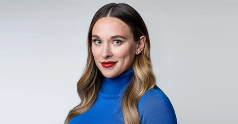 Ashley Flowers smiling confidently in a professional setting, representing her podcasting success and financial achievements related to Ashley Flowers Net Worth.