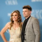 Rebecca St. James with husband Jacob 'Cubbie' Fink at a formal event, reflecting the Christian artist's personal life which contributes to her estimated $1-5 million net worth in 2025.