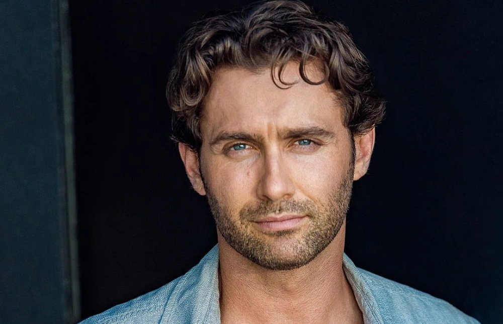 The actor and entrepreneur posing confidently, symbolizing his multifaceted success in entertainment and business.​