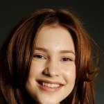 Portrait of Canadian actress smiling confidently—ideal for articles exploring Alexia Fast Net Worth and her journey through Hollywood fame.