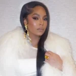 Alt Text: Woman in white fur coat with gold jewelry - not related to Brandon Siler Net Worth article