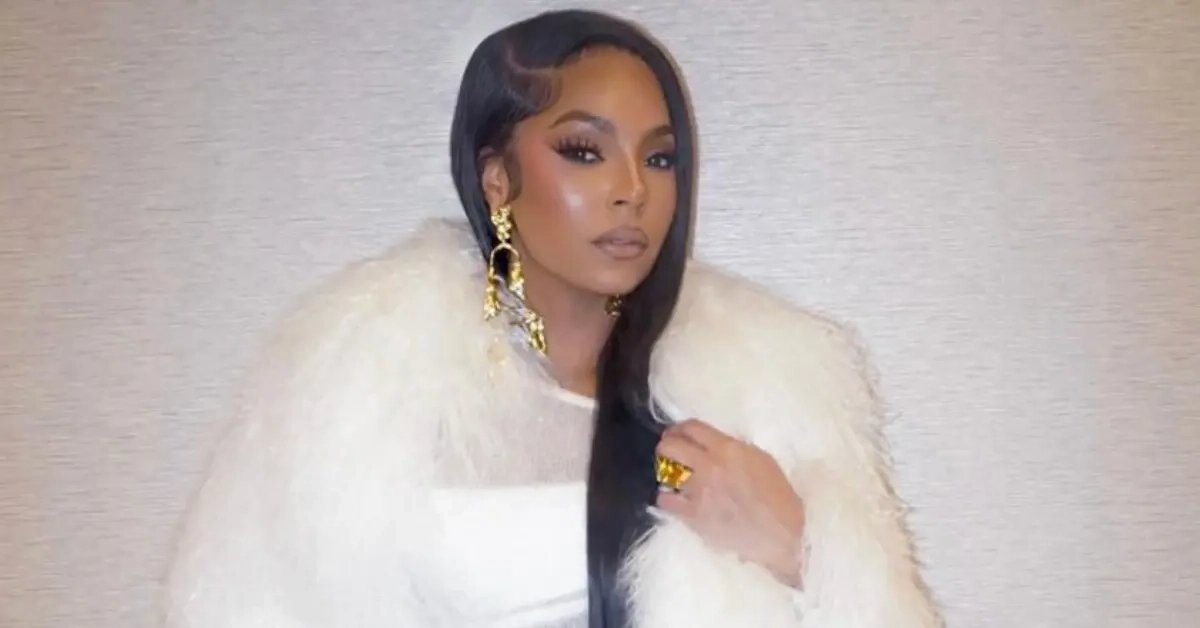 Alt Text: Woman in white fur coat with gold jewelry - not related to Brandon Siler Net Worth article
