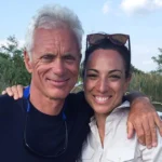 Jeremy Wade Wife—Jeremy Wade smiling with a woman by his side outdoors near a river, highlighting their close relationship for the article.