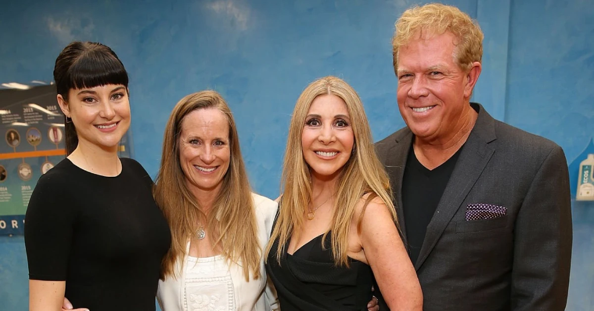 Lori Brice stands smiling with three others at an event, celebrating her achievements and inspiring journey.
