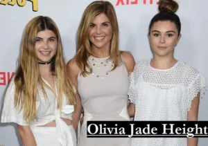 Olivia Jade Height showcased in a full-length photo of the social media influencer standing confidently during a red carpet appearance