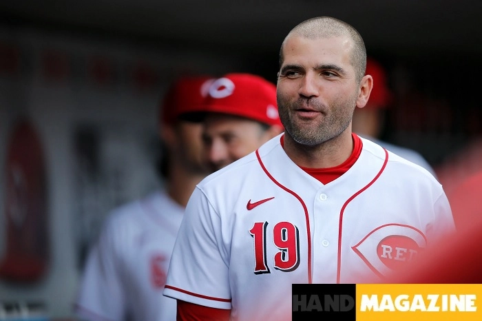 A bright portrait of Joey Votto in action on the baseball field, showcasing his iconic stance and focus during a important game.